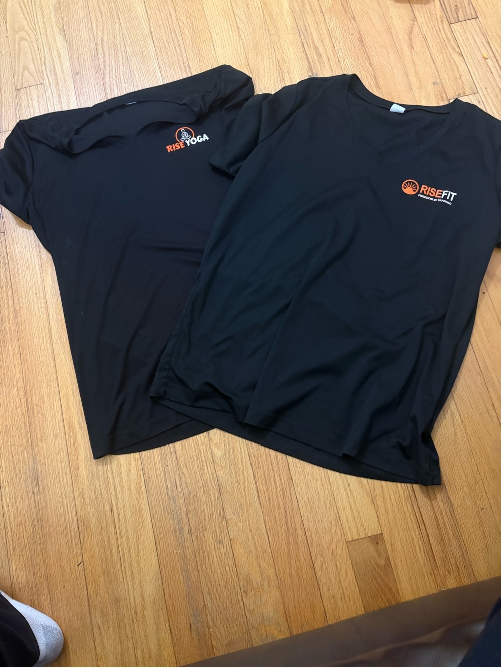 Sport-Tek Black Short Sleeve V neck Tee with Orange RiseFit/RiseYoga Logo